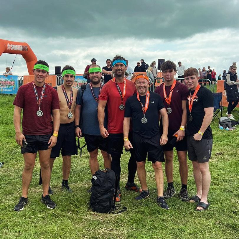 L3VEL UP team with medals at a Spartan race