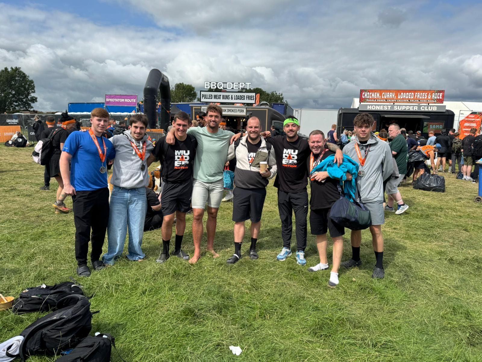 L3VEL UP team with medals at Tough Mudder