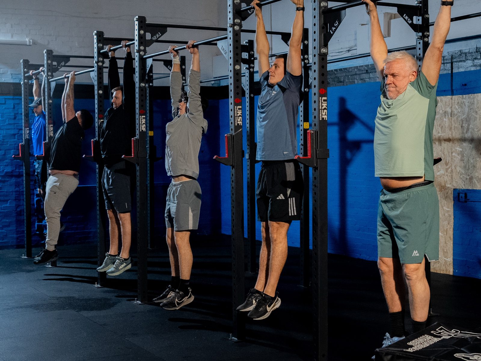 Members of all ages doing a dead hang together on the rigs